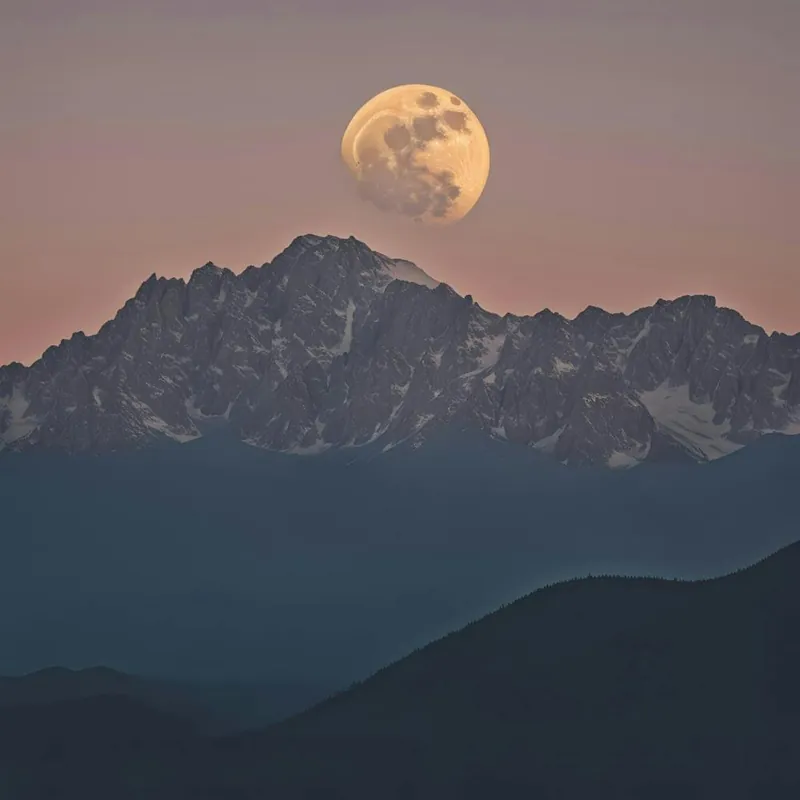Trending Full Moon Rising Over Mountains