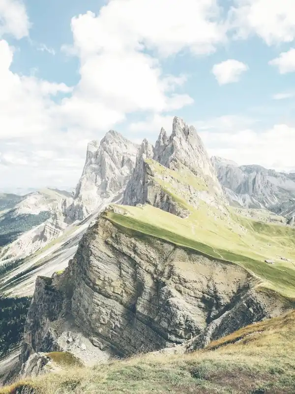 Seasonal Sale Dolomites, Italy I Seceda peaks with their sharp ridges in a majestic natural mountain landscape photography with its green valleys under pastel cloudy summer skies for a spectacular skyline panorama view